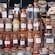 A spice shop displays an assortment of dried spices in glass containers